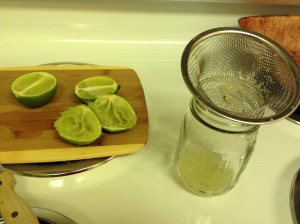 Juicing limes through the strainer